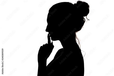 Young Woman Making A Sign By Finger Near Lips That Means Silence Or