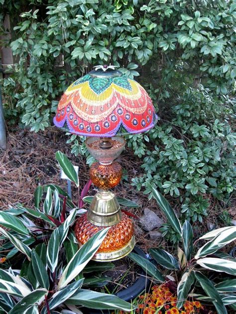 Spruce up your back garden on a budget with these budget garden ideas and upcycling projects that cost pennies. Whimsical Garden Art | Whimsical garden lamps and bird ...