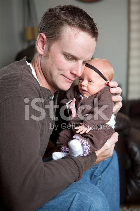 Father Holding Baby Stock Photos