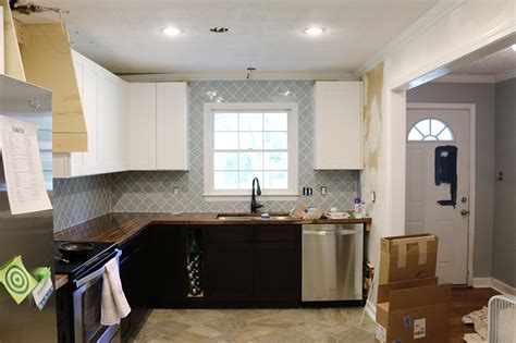A backsplash is a wall covering that is typically installed in the space above your kitchen countertop. Tile around a window how to and picking tile for the Pedrazas