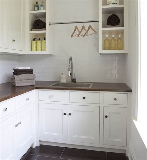 This bright and modern space proves a minimalist. Laundry Room Backsplash Design Ideas