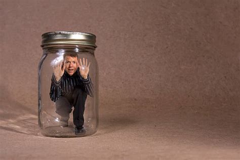 Businessman Trapped Inside Glass Jar Stock Photos Pictures And Royalty