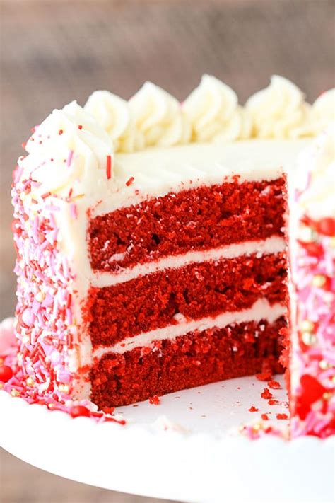 A traditional red coloured or dark red brown moist red velvet cake with white cream cheese icing or ermine frosting. Red Velvet Layer Cake - Life Love and Sugar
