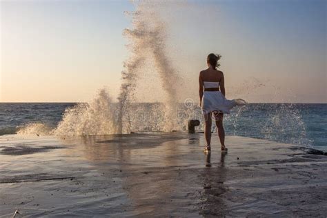 Girl Stands On The Pier And Looks At The Raging Sea Stock Image Image