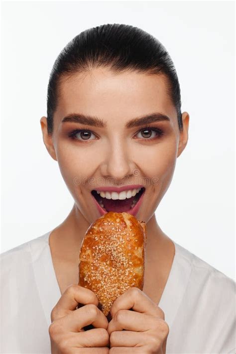 Portrait Of A Smiling Beautiful Woman With Collected Hair In The Studio