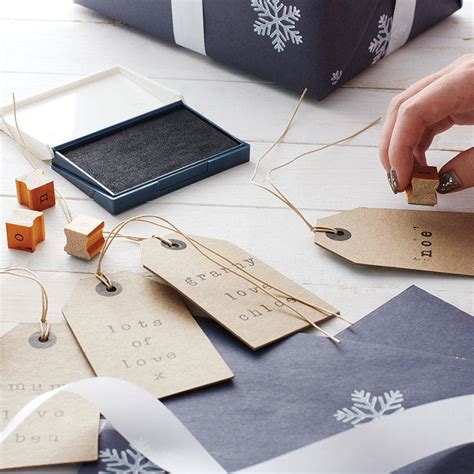 Make sure to lay the wrapping paper down carefully onto the sprayed cardstock, then flatten down with your finger or a bone folder so that you do not get creases or air bubbles in the wrapping paper. mini rubber alphabet stamps by the wedding of my dreams ...