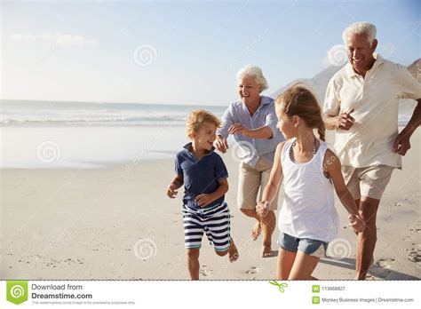 Check spelling or type a new query. Grandparents Running Along Beach With Grandchildren On ...