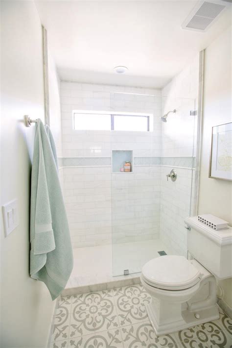 White tiles can really open up a room, with black grouting and accessories adding a bit of depth and style to your interior. White Small Bathroom With Patterned Floor | HGTV