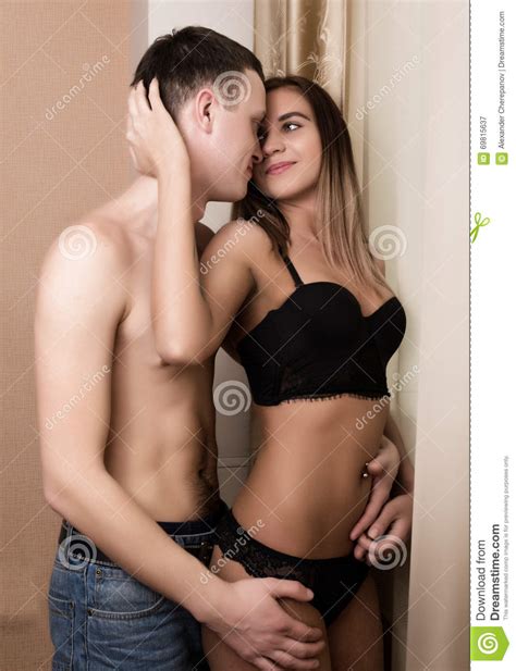 Young Attractive Romantic Couple Hugging And Kissing