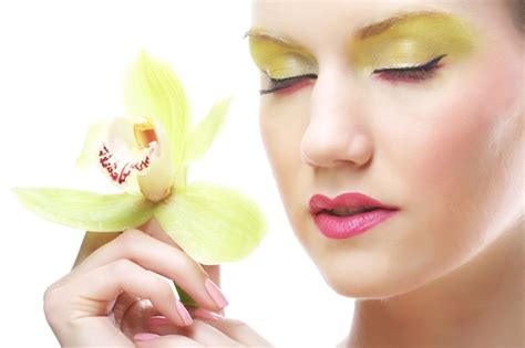 Premium Photo Young Woman With Bright Make Up Holding Orchid