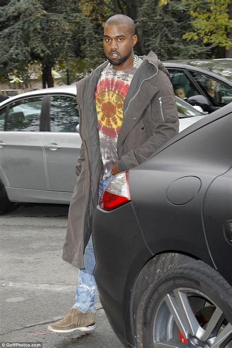 Kanye West Arrives At Céline Paris Fashion Week Show In A Baggy Grey