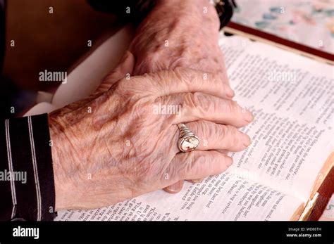 Elderly Hands On Bible Stock Photo Alamy