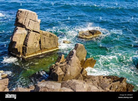 Sea Wave Attacks The Boulders Of Rocky Shore And Is Broken About Them