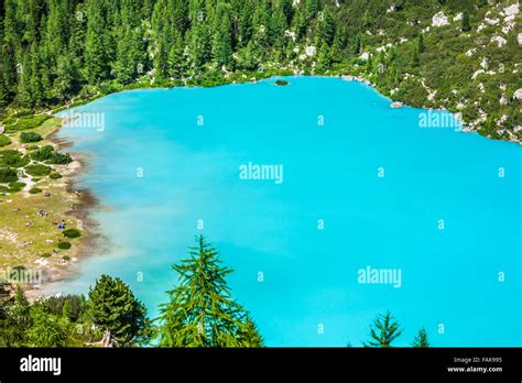 Turquoise Sorapis Lake In Cortina Dampezzo With Dolomite Mountains