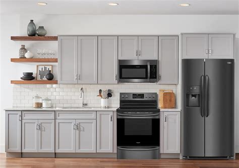 They're also less susceptible to condensation from dishwashers, greasy fingerprints if you are in the process of fully transitioning your kitchen to black stainless steel, it is perfectly acceptable to mix black appliances and. White Kitchen Cabinets With Black Stainless Steel ...