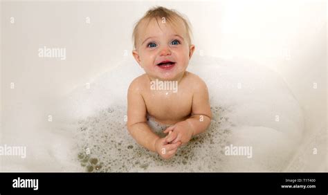 Happy Baby Boy Laughing In Bath Tub Stock Photo Alamy
