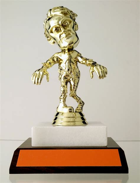 Walking Zombie Halloween Trophy On Flat Marble And Wood Slant Schoppy