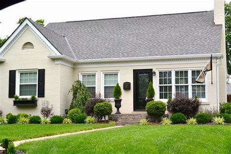 Older white painted brick house. 21 Rosemary Lane: Classic White Painted Brick Abodes
