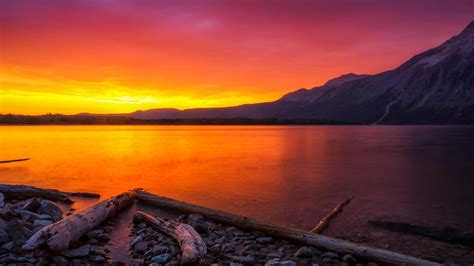 Orange Sunset Over A Mountain Lake
