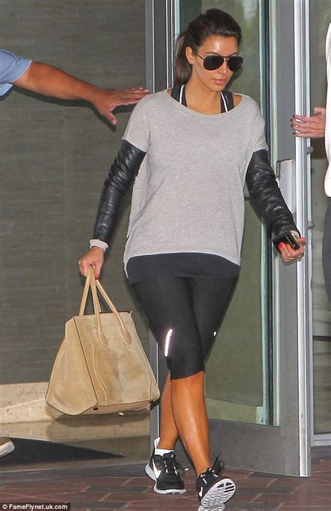 Kim Kardashian Exits Gym Wearing Top With Leather Sleeves Daily Mail
