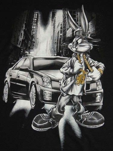 A T Shirt With An Image Of A Rabbit Holding A Key In Front Of A Car