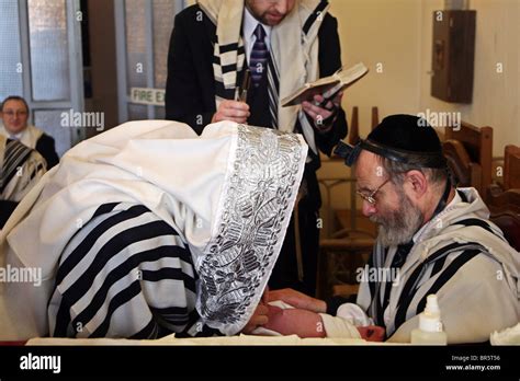 The Mohel Performs A Circumcision Ceremony On The 8th Day After Birth