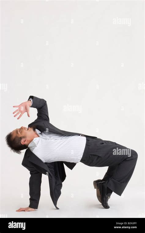 Side Profile Of A Businessman Bending Over Backwards Stock Photo Alamy