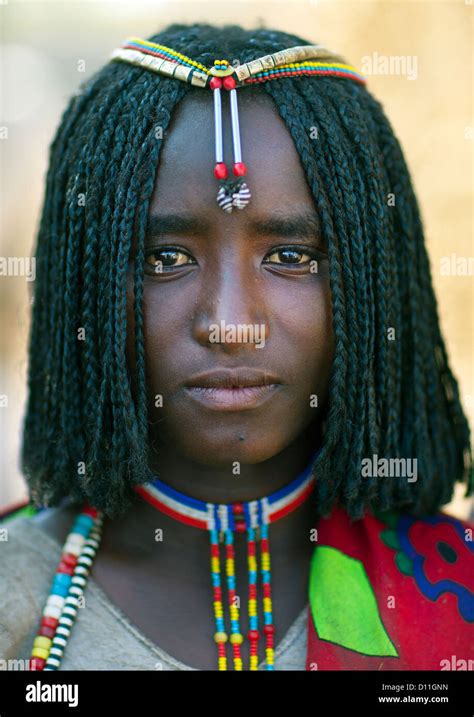 Portrait Of A Shy Karrayyu Tribe Girl With Stranded Hair And Colourful
