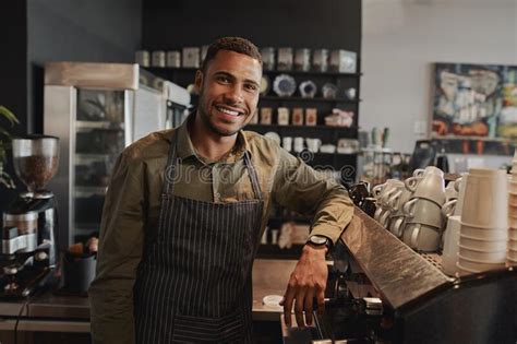 Portrait Of Young Afro American Male Business Owner Behind The Counter