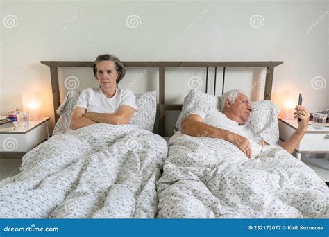 Senior Aging Married Couple Man Male And Female Woman Sleep Together In Bed Sexual Problems