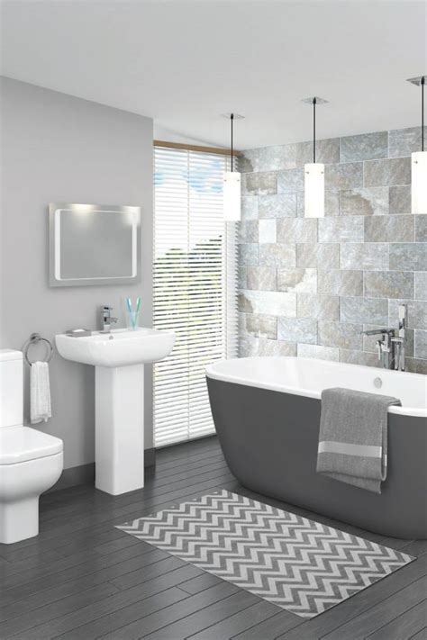 Bathroom remodeling, along with kitchen remodeling, takes its toll on homeowners in terms of misery, unmet timetables, and high costs. This beautiful grey bathroom design is complemented ...