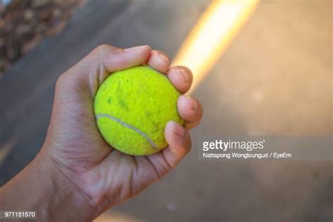 Hand Holding Tennis Ball Photos And Premium High Res Pictures Getty