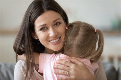portrait of happy mom and little daughter hugging stock image image of nanny emotional 176612539