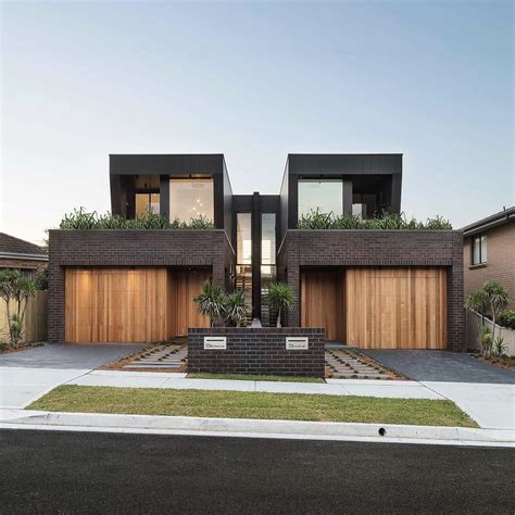 With A Sleek Mixture Of Brick Cladding Timber And Glass This Dual