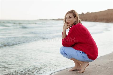 Happy Mature Woman Feeling The Breeze At Beach Beautiful Middle Aged