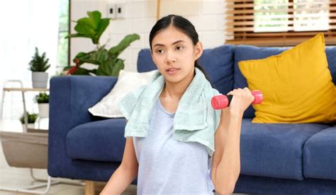 Exercise At Home Asian Girl Holding Dumbbell For Workout Fitness