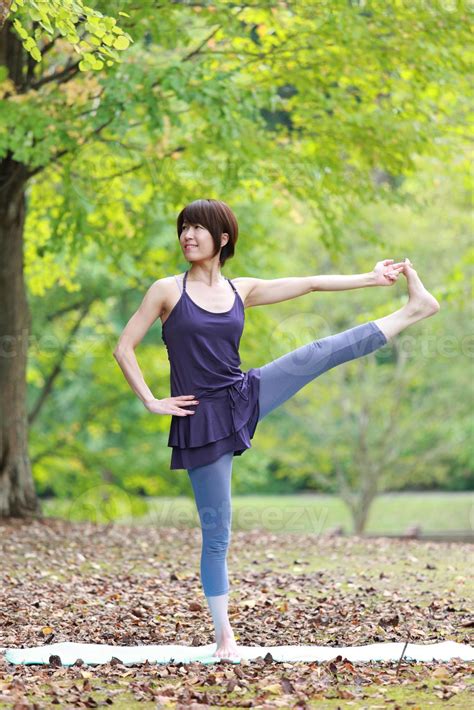 Japanese Woman Doing Yoga Extended Hand To Big Toe Pose 783531 Stock
