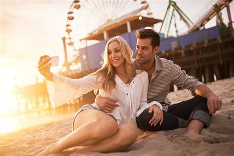 Romantic Couple Taking Selfie Together At Santa Monica Near Sunset Romantic Couple Taking Self