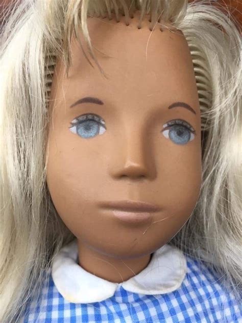 a blonde sasha in gingham from the early seventies
