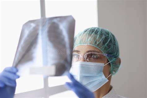 Female Doctor Examine X Ray Scan On Light Patients Lungs Diagnostic