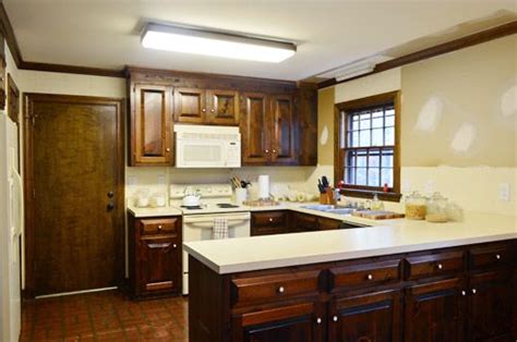 There could also be screws hidden under the hinges that hold the face frames tight. Removing Some Kitchen Cabinets & Rehanging One | Young House Love | Kitchen cabinets, Kitchen ...