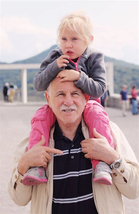 Grandfather Holding Granddaughter Stock Image Image Of Color