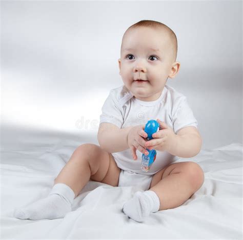 Image Of A Ten Month Old Baby Boy With Blue Rattle Stock Image Image