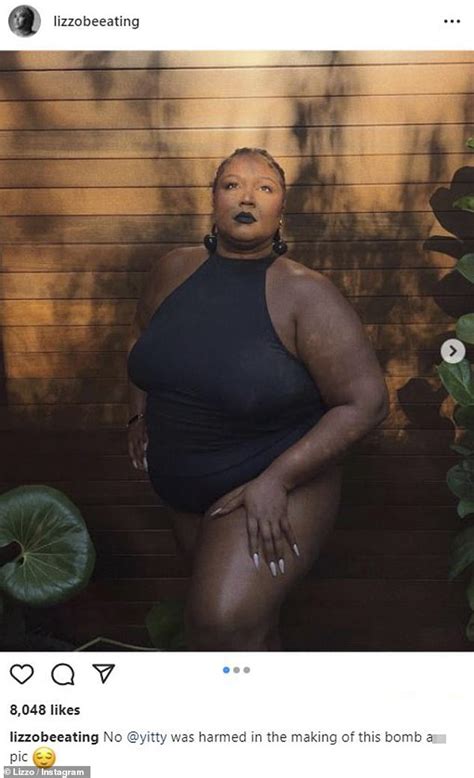Lizzo Looks Striking In Dark Lipstick As She Models A Black Top From