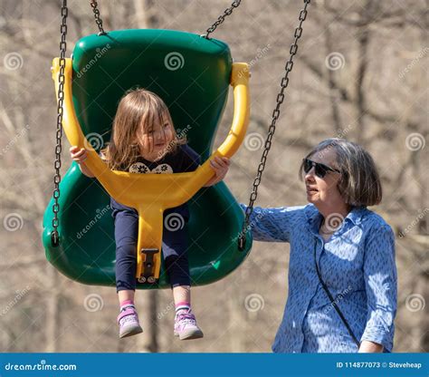 Grandmother And Granddaughter Play In Plastic Swing Stock Image Image Of Playground Lady