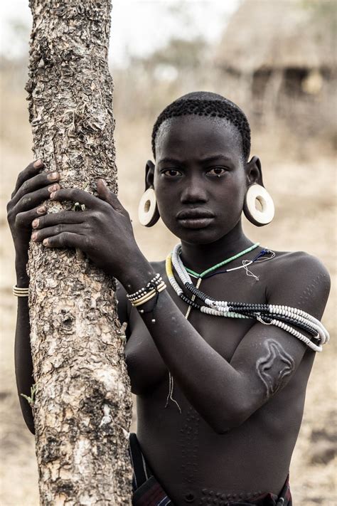 Pin By Abay Tadesse On Cultural African People Mursi Tribe Woman African Tribal Girls