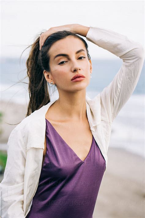 Outdoor Portrait Of Pretty Caucasian Female Model In Purple Swimsuit