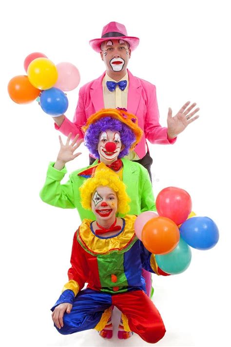 Three People Dressed Up As Colorful Funny Clowns Stock Photo Image Of