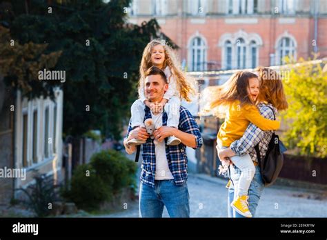 the unforgettable journey through the old town for a young family Stock