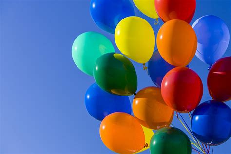 Colorful Balloons Against Blue Sky Photograph By Stuart Dee
